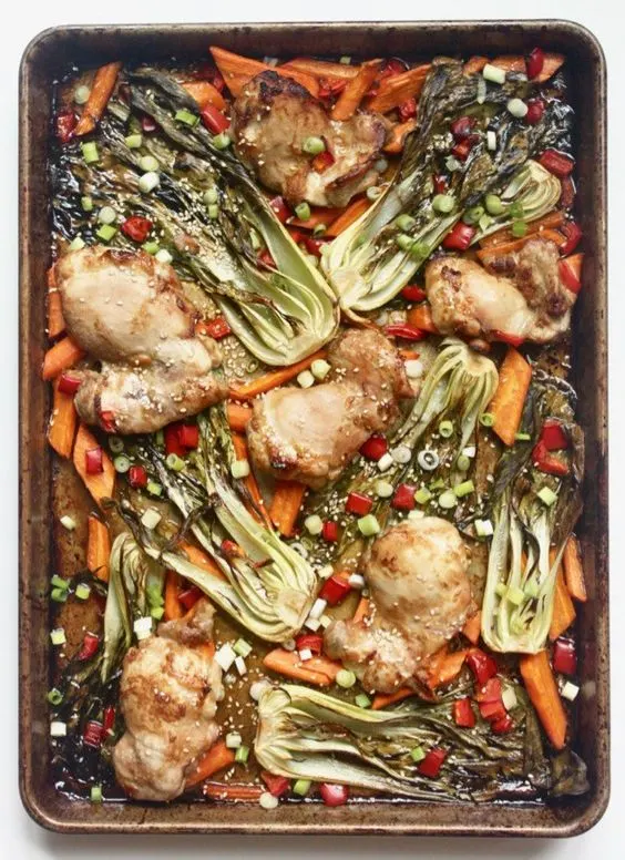 Everything you need for this Sesame Ginger Chicken and Vegetables meal cooks together on one sheet pan for easy clean up! This easy weeknight meal is a family favorite for good reason! Plus it's Whole30, paleo, gluten free, and dairy free!