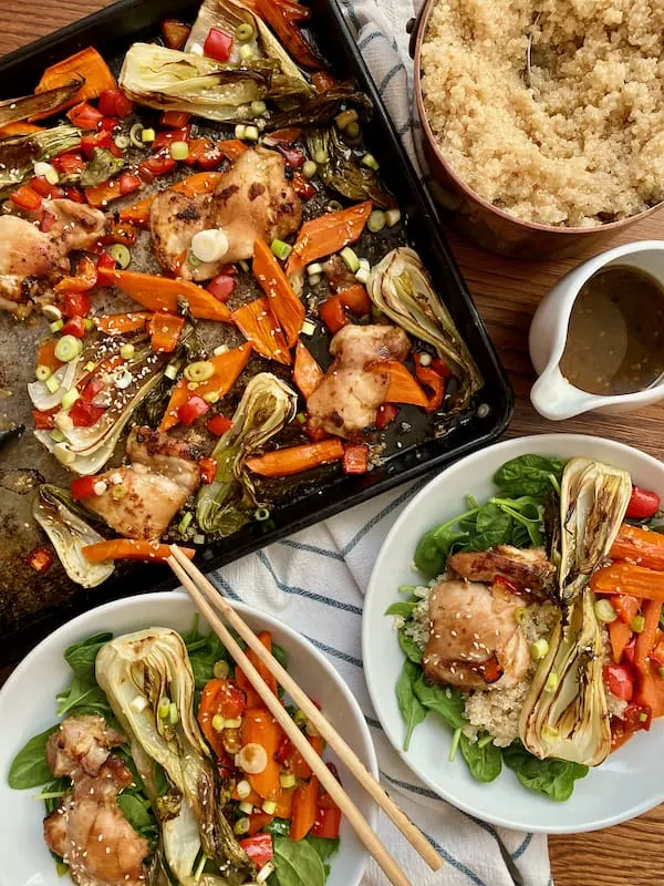 Gluten Free sesame ginger chicken and vegetables sheet pan meal served with quinoa