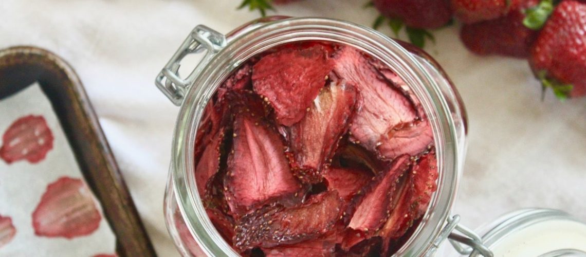Oven dried strawberry slices in a jar