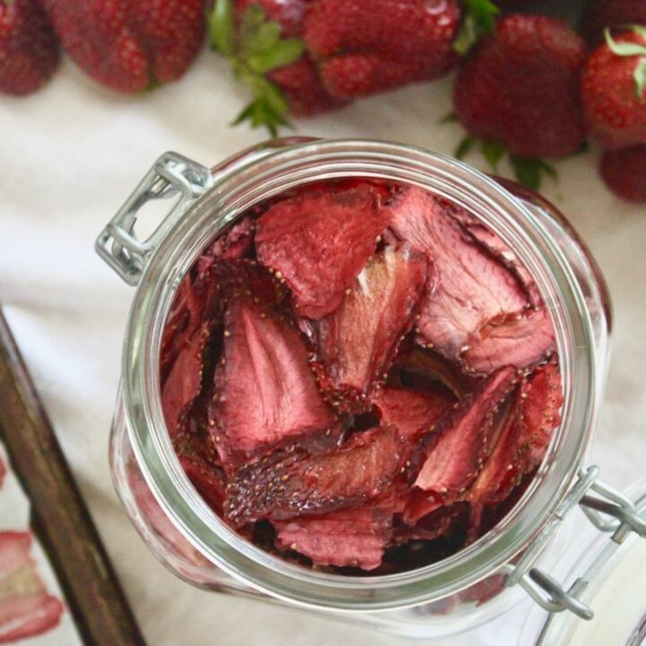 Oven dried strawberry slices in a jar