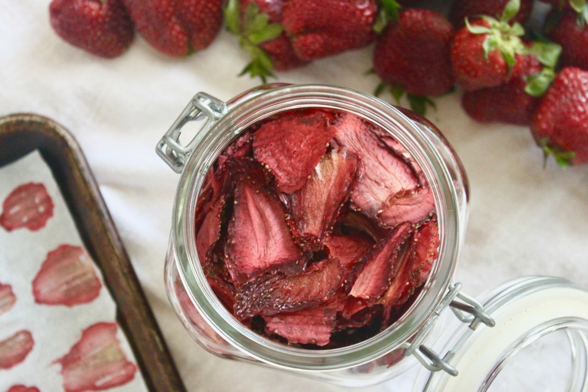 Oven dried strawberry slices in a jar