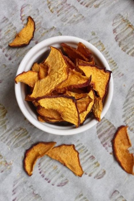 baked peach chips in a white ramikin