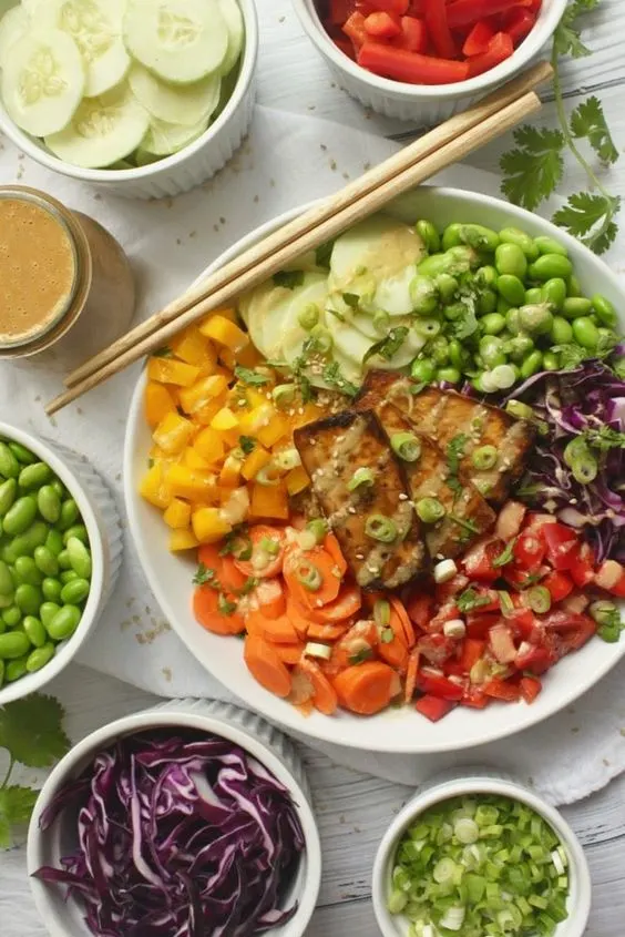 Healthy rainbow buddha bowls with oven baked crispy tofu
