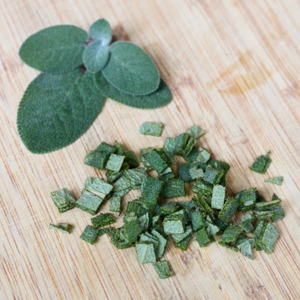 Finely diced sage for pistachio sage sauce