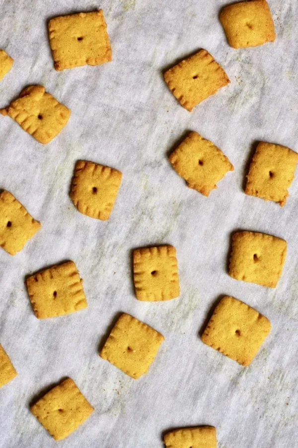 Homemade gluten free cheese crackers on a baking sheet 