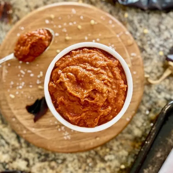 homemade mild harissa sauce in a white ramikin